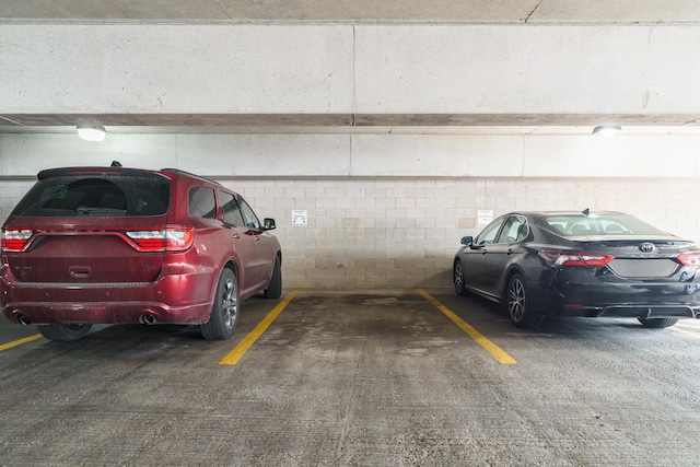 view of car parking featuring a parking deck