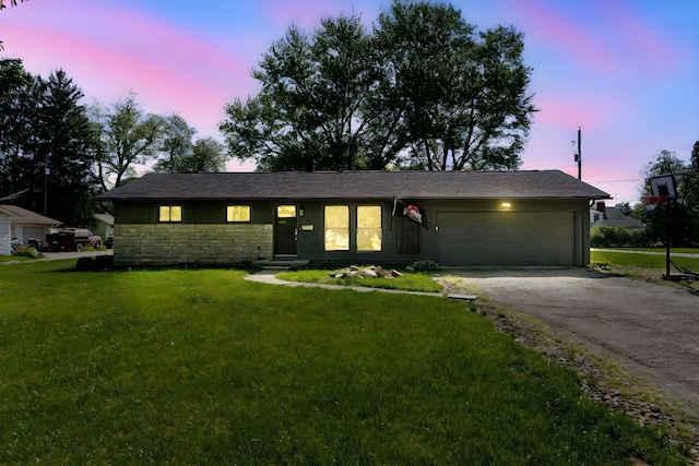 26 Garrick St, Newark, OH 43055 - ranch-style home featuring stone siding, an attached garage, a lawn, and driveway