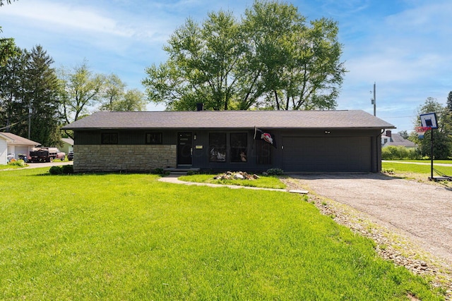 26 Garrick St, Newark, OH 43055 - single story home featuring an attached garage, asphalt driveway, a front yard, and stone siding