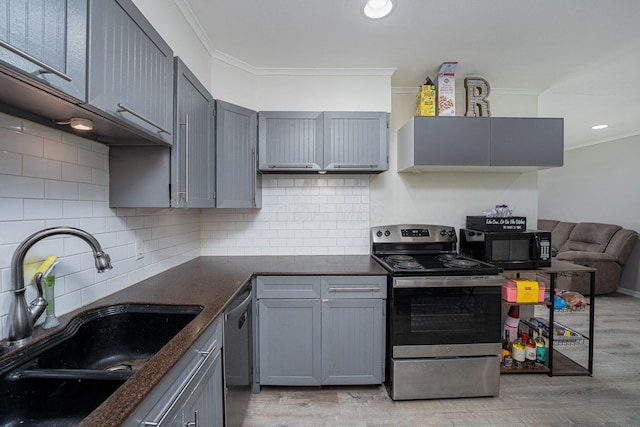 26 Garrick St, Newark, OH 43055 - kitchen with appliances with stainless steel finishes, a sink, ornamental molding, dark countertops, and gray cabinetry