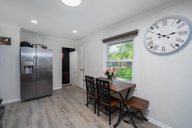 26 Garrick St, Newark, OH 43055 - dining area with light wood finished floors, baseboards, crown molding, and recessed lighting