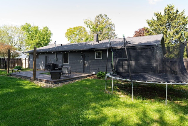 26 Garrick St, Newark, OH 43055 - back of property with a trampoline and a chimney
