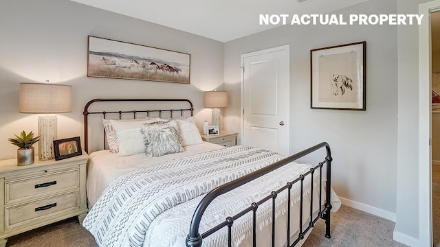 carpeted bedroom with baseboards