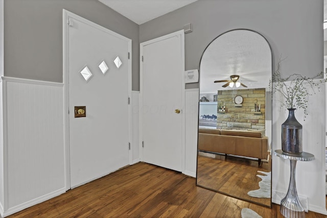 135 Fernhill Ave, Columbus, OH 43228 - foyer entrance featuring a ceiling fan, dark wood-type flooring, and a wainscoted wall