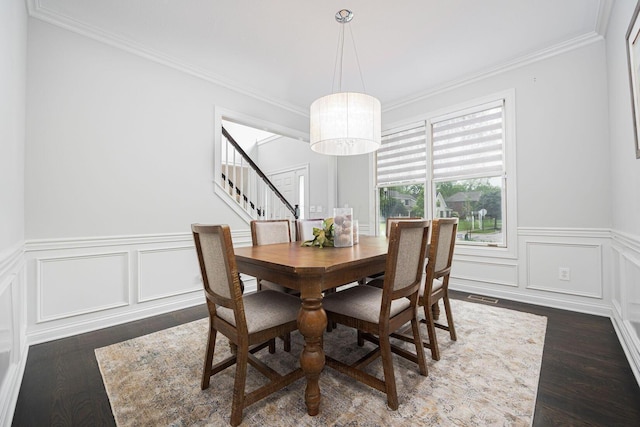 382 Beecher Rd, Columbus, OH 43230 - dining area with stairway, dark wood finished floors, crown molding, a wainscoted wall, and a decorative wall