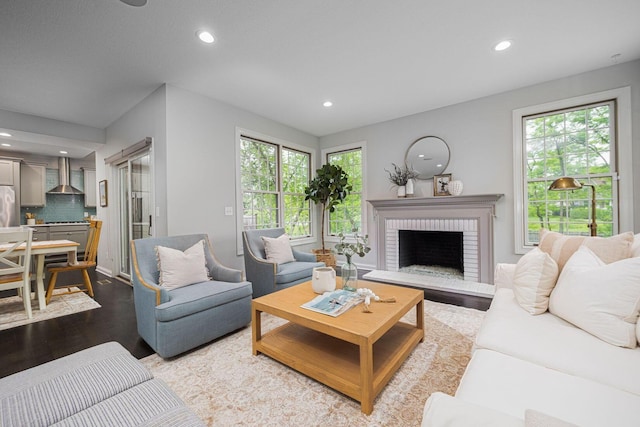 382 Beecher Rd, Columbus, OH 43230 - living area featuring wood finished floors, recessed lighting, healthy amount of natural light, and a brick fireplace