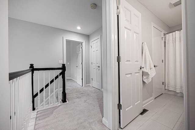 382 Beecher Rd, Columbus, OH 43230 - corridor featuring an upstairs landing, baseboards, and recessed lighting