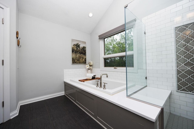 382 Beecher Rd, Columbus, OH 43230 - bathroom with vaulted ceiling, a garden tub, baseboards, and recessed lighting