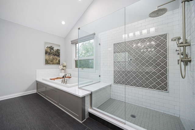 382 Beecher Rd, Columbus, OH 43230 - full bathroom featuring a shower stall, recessed lighting, baseboards, decorative backsplash, and high vaulted ceiling