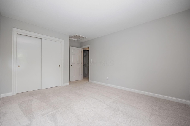 382 Beecher Rd, Columbus, OH 43230 - unfurnished bedroom featuring light carpet, attic access, a closet, and baseboards