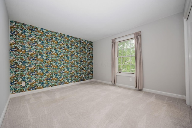 382 Beecher Rd, Columbus, OH 43230 - empty room featuring carpet, wallpapered walls, and baseboards