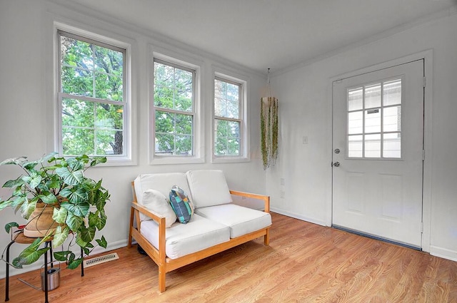 668 Enfield Rd, Columbus, OH 43209 - living area with light wood-style floors and ornamental molding