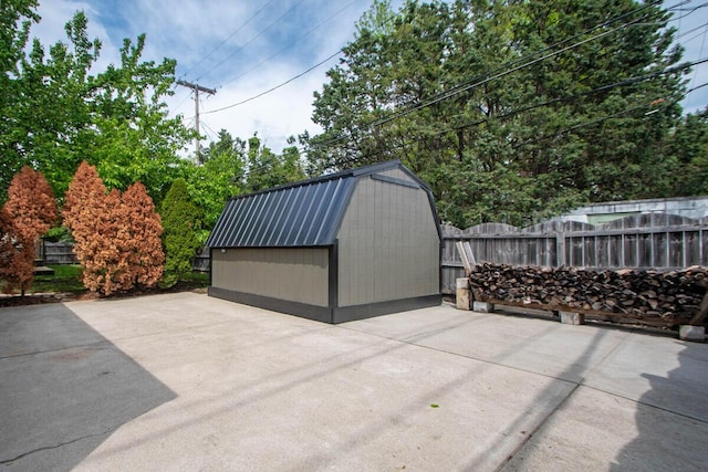 668 Enfield Rd, Columbus, OH 43209 - view of patio / terrace with a shed, fence, and an outbuilding