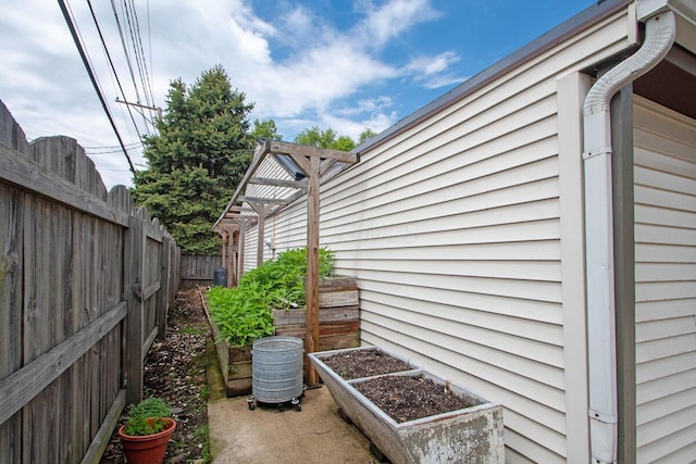 668 Enfield Rd, Columbus, OH 43209 - view of home's exterior featuring fence and a vegetable garden