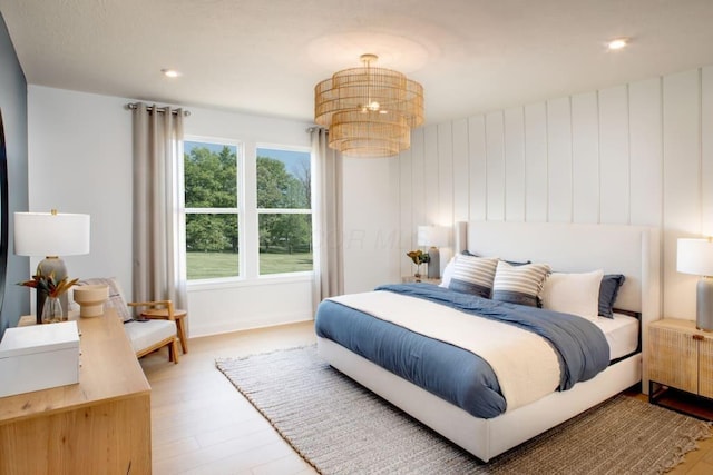 bedroom featuring recessed lighting, baseboards, and wood finished floors