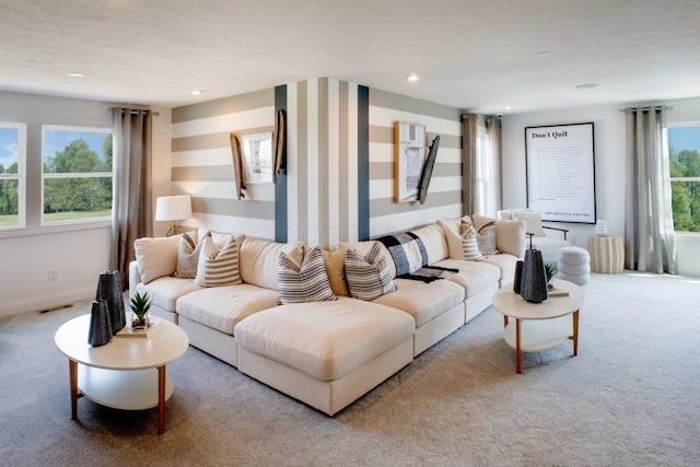 carpeted living room featuring baseboards and recessed lighting