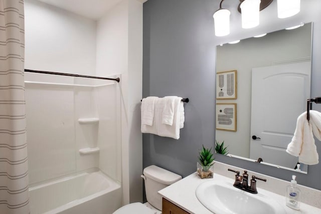 bathroom with toilet, shower / tub combo, and vanity