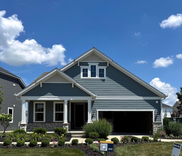 6344 Zuccaro Dr Lot 136, Hilliard, OH 43026 - craftsman inspired home with covered porch, an attached garage, and stone siding