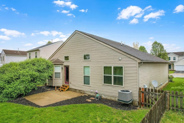 2099 Winding Hollow Dr, Grove City, OH 43123 - rear view of house with a lawn, a patio, central AC, entry steps, and a fenced backyard