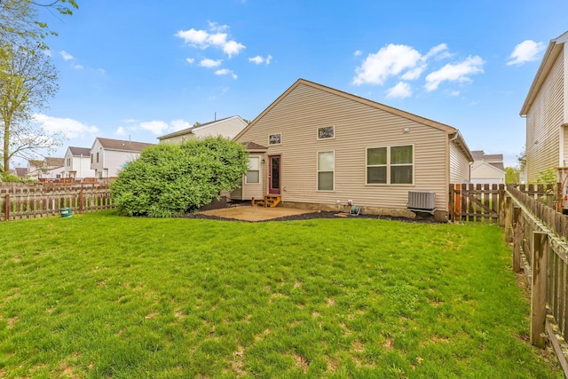 2099 Winding Hollow Dr, Grove City, OH 43123 - back of house with a lawn, central air condition unit, a patio, and a fenced backyard