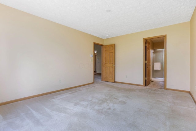 2099 Winding Hollow Dr, Grove City, OH 43123 - unfurnished bedroom featuring light colored carpet, a textured ceiling, and baseboards