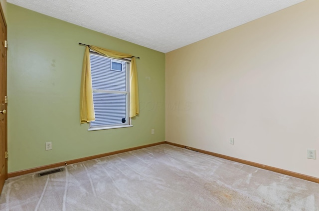 2099 Winding Hollow Dr, Grove City, OH 43123 - unfurnished room with baseboards, a textured ceiling, and carpet