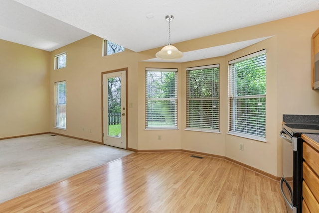 2099 Winding Hollow Dr, Grove City, OH 43123 - unfurnished dining area featuring baseboards, visible vents, and light wood-style floors