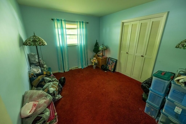 interior space featuring carpet, a closet, and visible vents