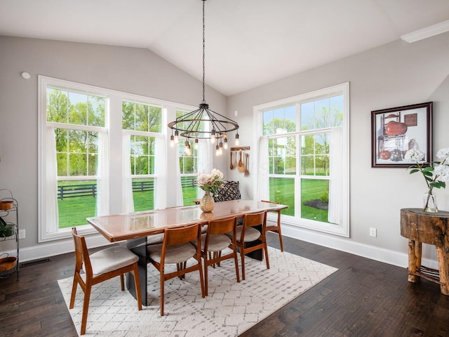 dining area with baseboards, plenty of natural light, and vaulted ceiling