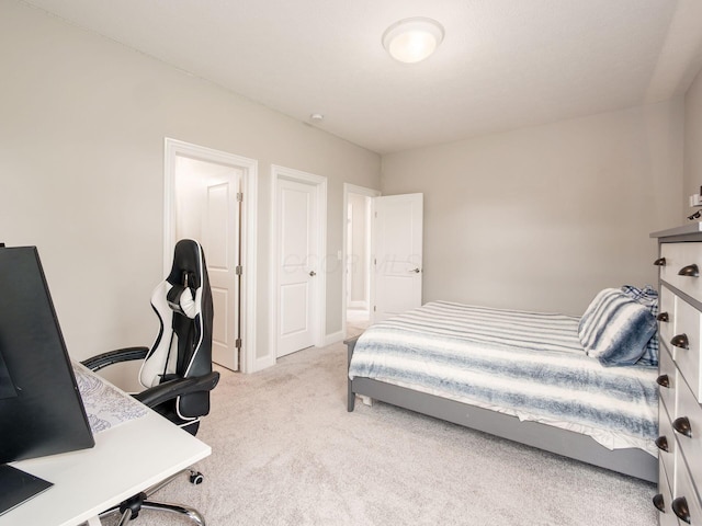carpeted bedroom with baseboards