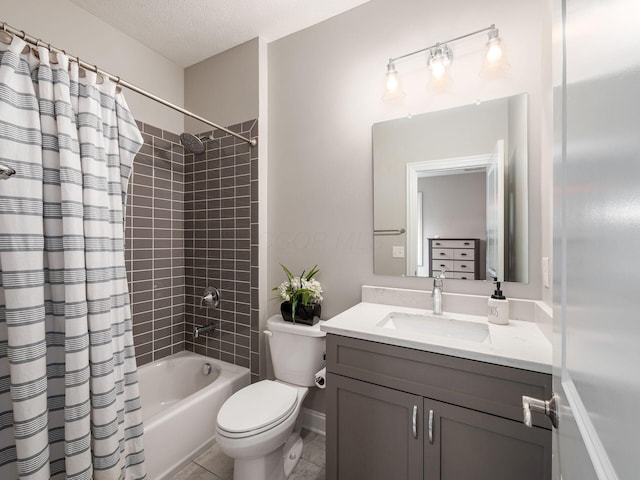 full bath with toilet, shower / tub combo with curtain, vanity, and a textured ceiling