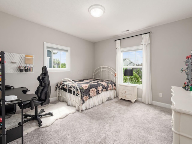 bedroom with carpet, baseboards, and visible vents