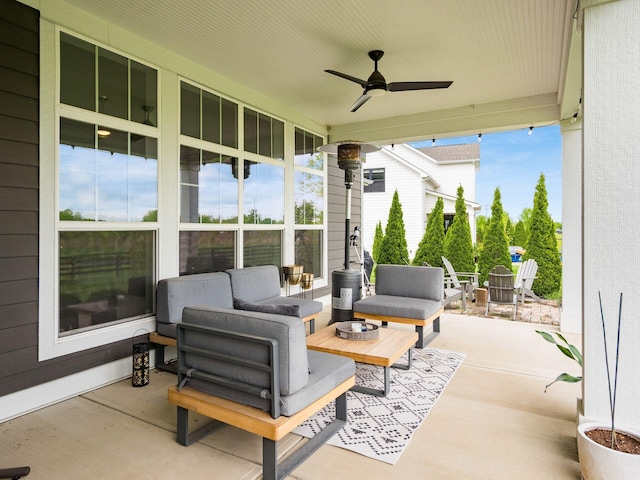 view of patio featuring a ceiling fan and an outdoor living space