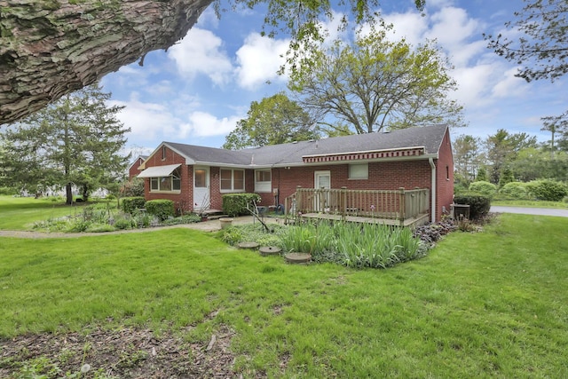 ranch-style home with a front yard and brick siding
