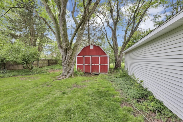 view of yard featuring a barn and an outbuilding
