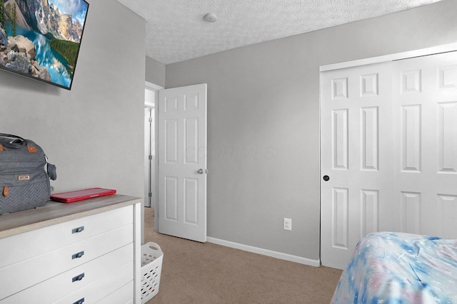 4830 Brice Pond Dr Unit 1A, Canal Winchester, OH 43110 - bedroom featuring light colored carpet, a closet, baseboards, and a textured ceiling
