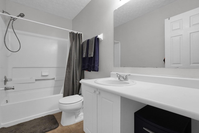 4830 Brice Pond Dr Unit 1A, Canal Winchester, OH 43110 - full bathroom featuring a textured ceiling, shower / bath combo with shower curtain, tile patterned floors, vanity, and toilet