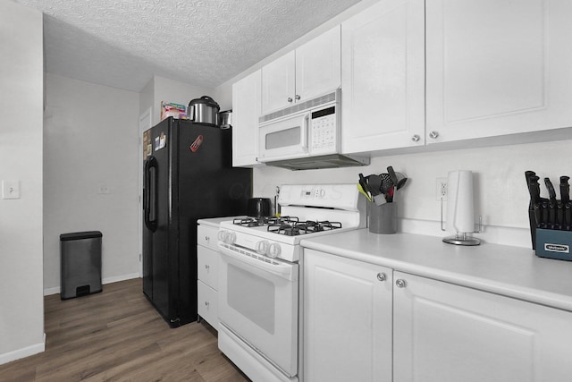 4830 Brice Pond Dr Unit 1A, Canal Winchester, OH 43110 - kitchen with white appliances, white cabinets, wood finished floors, and a textured ceiling