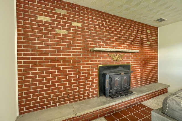 interior details with a wood stove and visible vents
