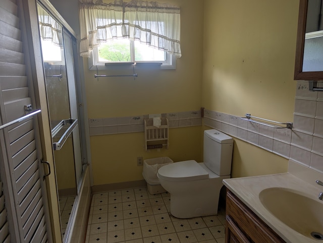 full bathroom with vanity and toilet