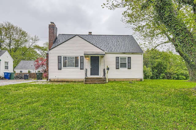 3140 Hamilton Ave, Columbus, OH 43224 - bungalow-style house with a chimney, a shingled roof, and a front lawn