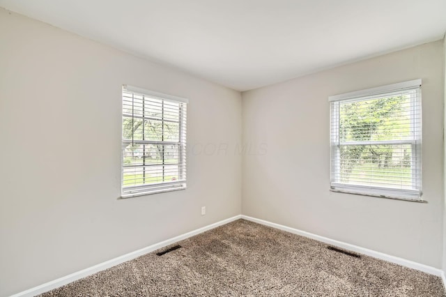 3140 Hamilton Ave, Columbus, OH 43224 - carpeted spare room with baseboards
