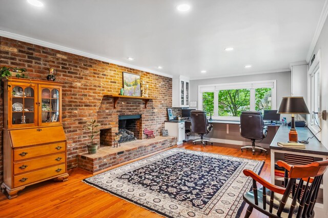 home office with wood finished floors, ornamental molding, recessed lighting, a fireplace, and baseboards