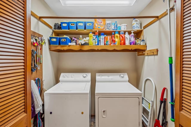 clothes washing area featuring washer and dryer