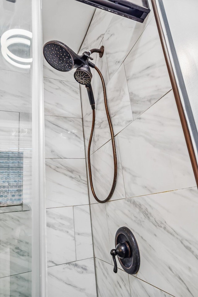 bathroom view of tiled shower