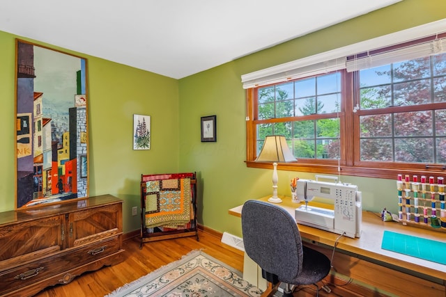 office space featuring wood finished floors and baseboards