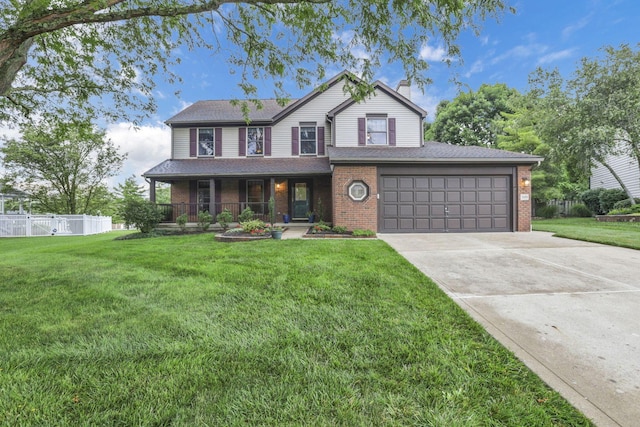 7689 Godfrey Cir, Reynoldsburg, OH 43068 - view of front of home with brick siding, a porch, driveway, and a chimney