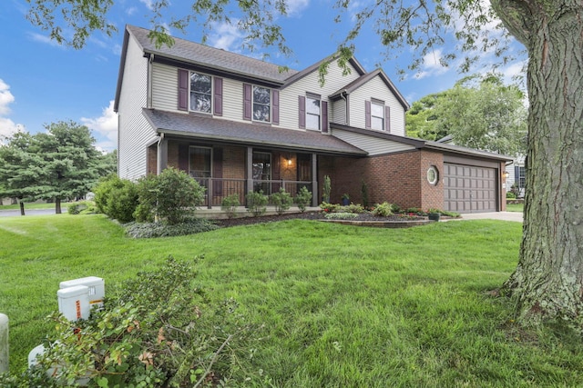 7689 Godfrey Cir, Reynoldsburg, OH 43068 - view of front facade with a porch, brick siding, a garage, and a front lawn