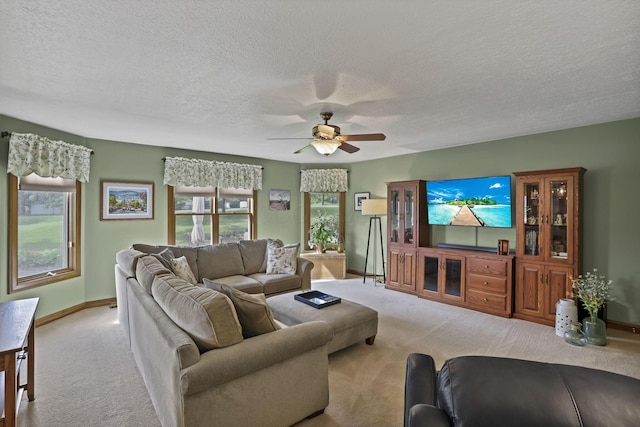 7689 Godfrey Cir, Reynoldsburg, OH 43068 - living area with carpet flooring, a ceiling fan, and a textured ceiling