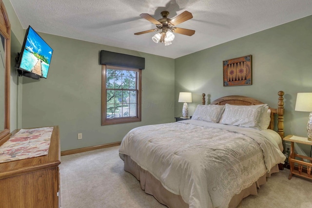 7689 Godfrey Cir, Reynoldsburg, OH 43068 - bedroom with light colored carpet, a textured ceiling, and ceiling fan
